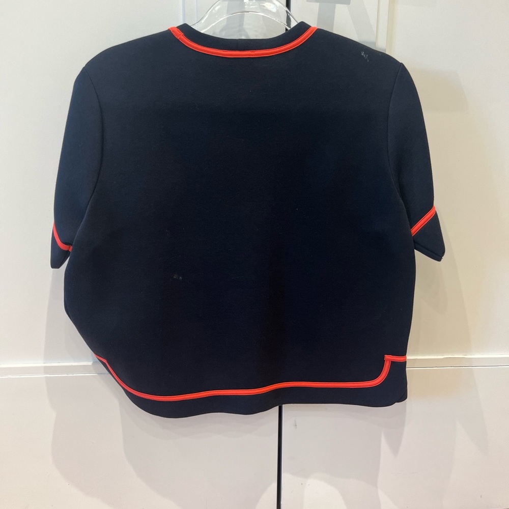 Red Valentino black scuba top with coral trim